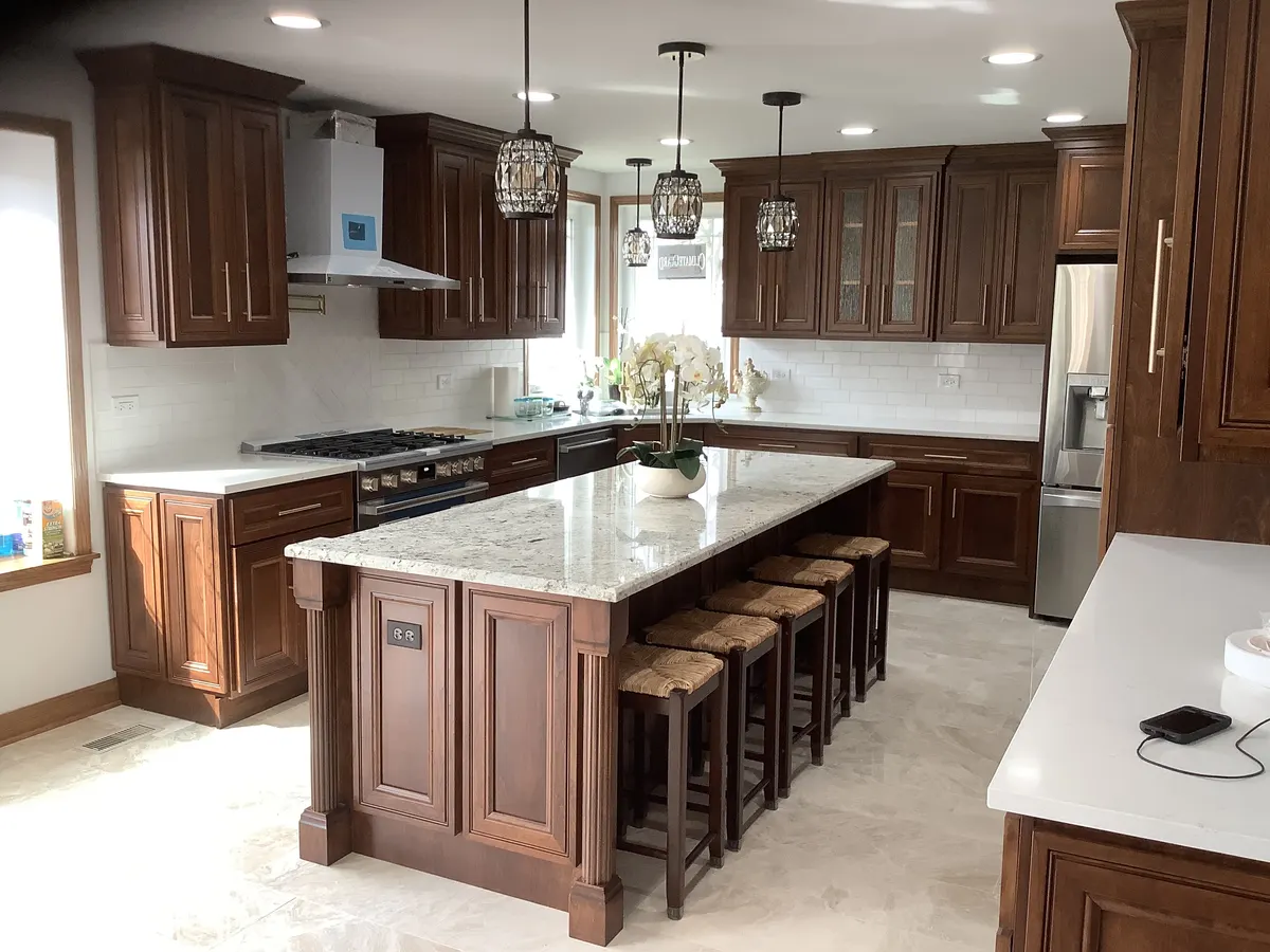 Rich chocolate-stained custom kitchen with a large center island